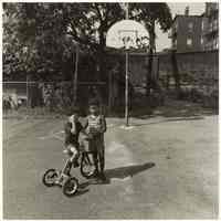 B+W photo of two young boys at a playground, Hoboken, no date, [1976].