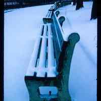 Color slide of snow on benches.