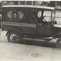 B+W photo of Robert Kirchgessner with a United Decorating Co. Model T truck, Hoboken, 1917.