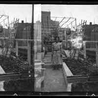 Black-and-white negative strip with four images of a woman and man on a rooftop with garden, Hoboken, no date, ca. 1930-40.