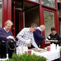 Color photos, 3, of Hurricane Sandy relief; serving food & coffee outside Amanda