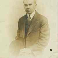 Photo postcard of an unidentified young man in suit, no place, no date, ca. 1900-1910.