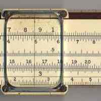          with slide inverted for back scales S, L, T; serial number at left
   