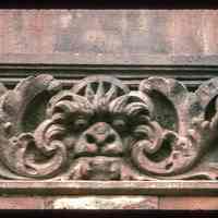 Color slide of close-up view of decorative tile on a building on Bloomfield between 10th and 11th