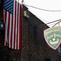 Color photo of the sign of the Hudson County Pistol Range & Gun Shop, Hoboken, Jan. 3 & 4, 2002.