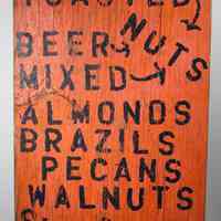 Sign, painted single-sided, wood, "Honey Roasted Nuts." Roadside vendor, Hoboken vicinity, 1980s-1990s.