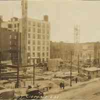 Sepia-tone photo of steel frame erection on the site for the Fabian Theatre, southeast corner of Newark & Washington Sts., Hoboken, Feb. 6, 1928.