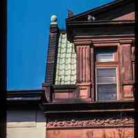 Color slide of detail view of mansard roof, pediment, pilasters, cornice, frieze and window head at 512 Hudson between 5th and 6th