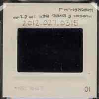          Color slide of eye-level view of six people sorting through debris at an unidentified location on the block bordered by Hudson, River, 1st and 2nd picture number 2
   