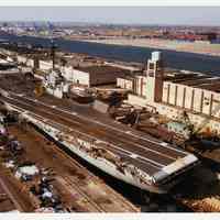 B+W photo of U.S.S. Intrepid in graving dock at MOT, Bayonne, winter, probably 1981.