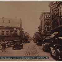 Sepia-tone copy photo of First St. looking west from Washington St., Hoboken, ca. 1930.