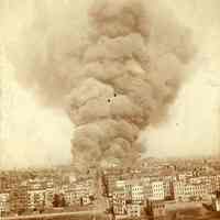 Sepia-tone photo of the Hoboken pier fire taken from Jersey City Heights, June 30, 1900.