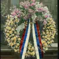 Lantern slide, color, of a floral wreath, used for promotional display in Hoboken, no date, ca. 1920.