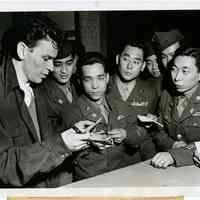 Sinatra photo: Frank Sinatra signing autographs for Nisei members of 442nd Infantry Combat Team, Hollywood, CA, Jan. 6, 1946.