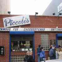 Digital copy of color photo of food tour members outside Piccolo