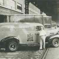 B+W photo of trucks of R. Neumann & Co. parked on Observer Highway west of Willow Avenue, Hoboken, August 7, 1939.