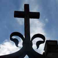          42: detail of cross on iron work entry arch, Willow Avenue entrance
   