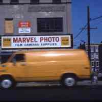 Color slide of the storefront of Marvel Photo, 134 Washington St., Hoboken, 1983.