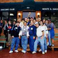 Color group photo of members of the Monte San Giacomo Democratic Club, Inc. outside the building at 531 Adams St., Hoboken, no date, ca. 2000.