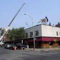 Color photo of northwest corner of Newark & River Sts. with Clam Broth House finger sign, Hoboken, June 1, 2006.