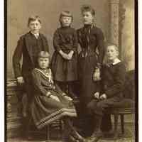 Cabinet photo of young Sanntrock family members posed in photographer