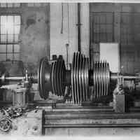 B+W photo of low pressure turbine rotor of the S.S. Bonheur on a lathe, machine shop, Jan., 1938.