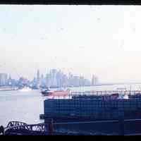 Color slide of Hoboken dock and Manhattan skyline.