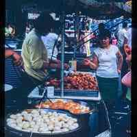 Color slide of a food stall at a street fair.