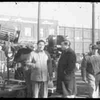 Color slide of a camera set-up with some cast and crew on pier set of the motion picture "On the Waterfront", Hoboken, n.d., ca. late 1953-early 1954.