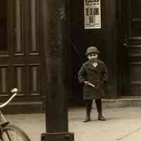          detail left: theatre posters, boy, bicycle
   