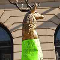 Color photos, 2, of Elks statue with sign "Free Hot Food Water" outside Elks Lodge, 1005 Washington St., for Hurricane Sandy relief efforts, Hoboken, Oct 31-Nov. 1, 2012.