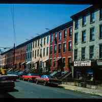 Color slide of eye-level view of row houses on the W side of Garden looking S with Di Gennaro