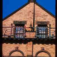          Color slide of close-up view of brick pediment, pilasters, semicircular arches, window heads and railings at 830 Hudson between 8th and 9th picture number 1
   