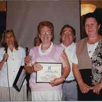 Color photo of the owners of 615 Willow Avenue receiving framed Hoboken Heritage Award, Hoboken City Hall, June 27, 1997.