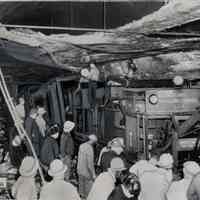 B+W photo of tow truck removing truck from Holland Tunnel after fire, May 18, 1949.