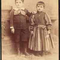 Cabinet photo of two boys posed in fine dress, New York studio, no date, circa 1895-1900.