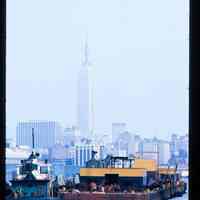 Color slide of a tug boat and barge on the Hudson River.