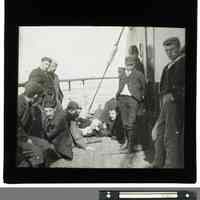 B+W lantern slide of Irish immigrants on deck of a ship, n.p. (U.K.), 1898.