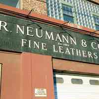          Color photo of a wall sign for R. Neumann & Co., Est. 1883, Fine Leathers, 300 Observer Highway, Hoboken, Jan. 3 & 4, 2002. picture number 1
   