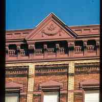          Color slide of detail view of pediment, cornice, brackets and window heads at an unidentified location picture number 1
   