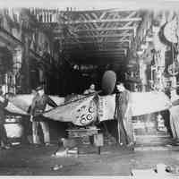 B+W photo of workmen & propeller of S.S. El Coston, United Dry Dock Co., Hoboken, Nov. 1937