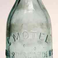 Bottle: Motel & Co., Cor. of 8th & Garden St., Hoboken, N.J. N.d. ca. 1890-1910.