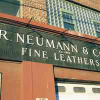          Color photo of a wall sign for R. Neumann & Co., Est. 1883, Fine Leathers, 300 Observer Highway, Hoboken, Jan. 3 & 4, 2002. picture number 2
   