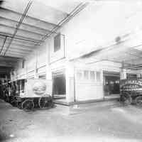Sepia-tone photo of men working in the moulding room at John Schmalz