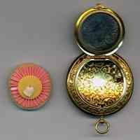          view open with powder puff removed; note mirror condition
   