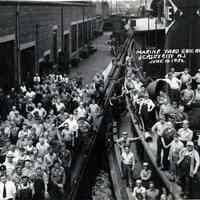 B+W photo of workers on pier and tugboat at the Marine Yard, Erie Railroad, Jersey City, N.J., June 10, 1932.