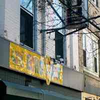 Color photo of hanging sign for Hoboken Furniture and wall sign for Echo Art, 157 First Street, Hoboken, Jan. 3 & 4, 2002.