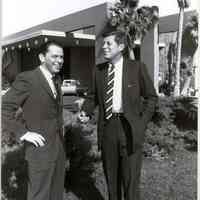 B+W repro photo of Frank Sinatra with Presidential nomination candidate, Sen. John F. Kennedy, outside Sands Hotel, Las Vegas, NV, ca. Feb. 7 , 1960.