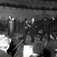 B+W photo of Frank Sinatra, Sammy Davis, Jr., Dean Martin and Jan Murray performing at Carnegie Hall, N.Y., Jan. 27, 1961.