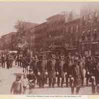 Sepia-tone photo of Hoboken Police marching in parade, Washington St.between Third & Fourth Sts., Hoboken, ca. 1905.